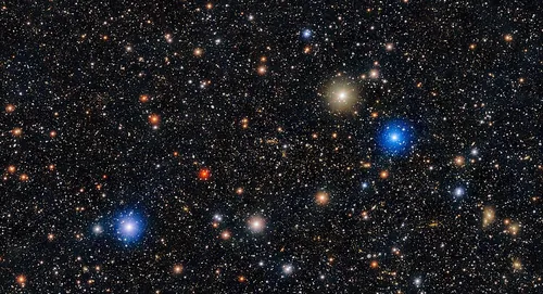 The Bullet Cluster is made up of two galaxy clusters that are colliding, one moving through the other, about 3.7 billion light-years away in